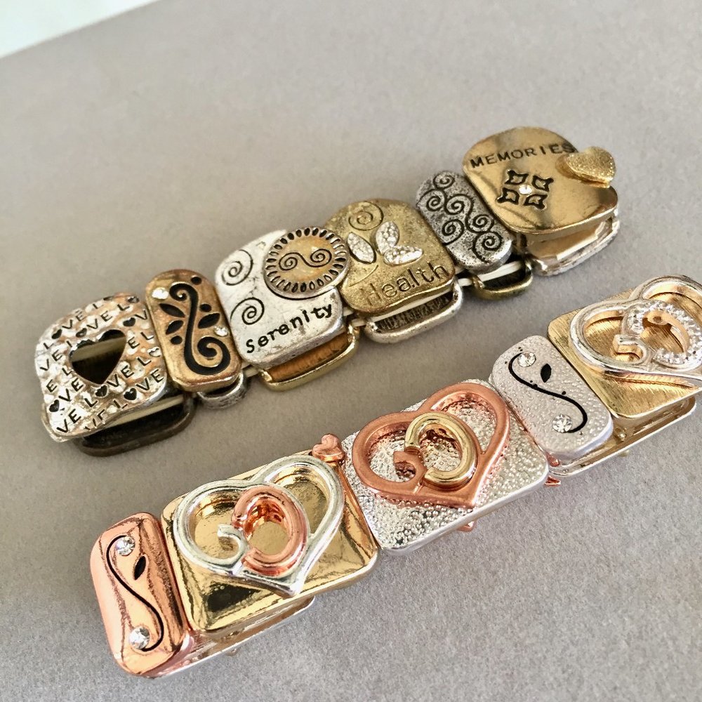 Two lovely expandable bracelets. One is heart themed and One words that inspire